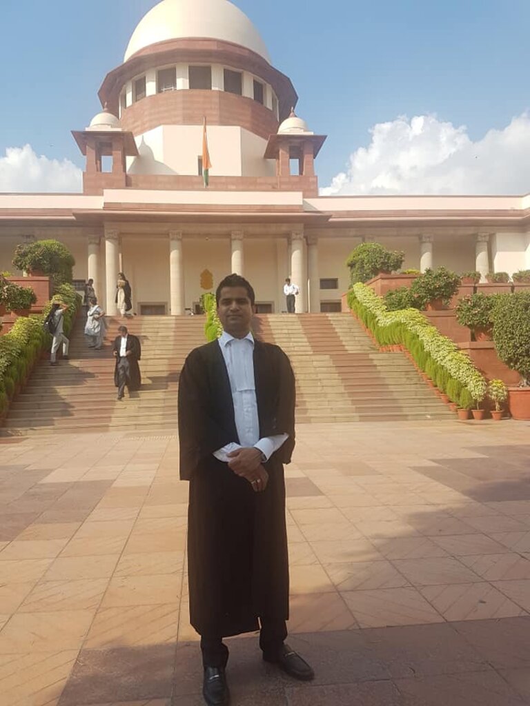 Advocate Naveen Arya in advocate's robe outside the Supreme Court of India